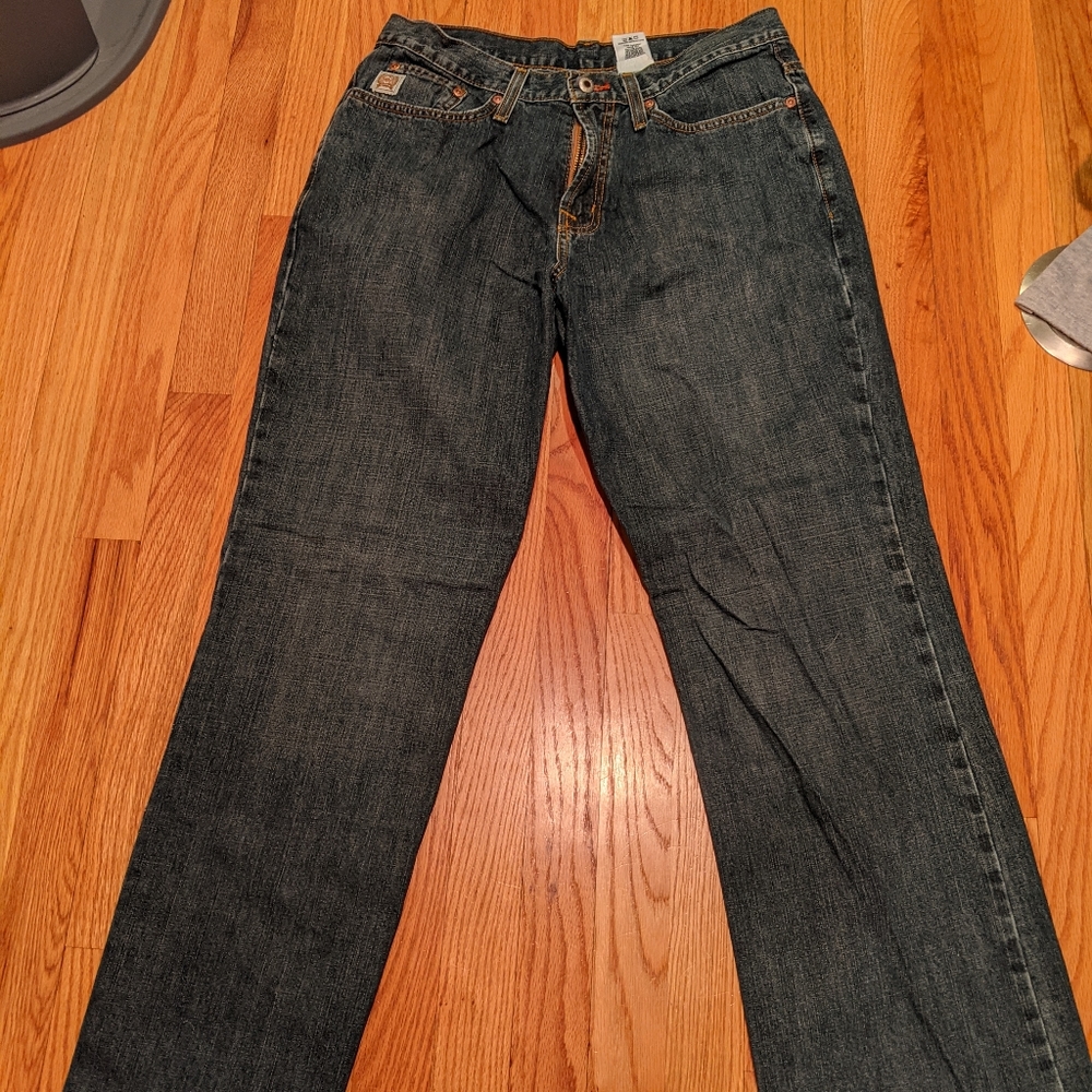 2 different pairs of cinch jeans